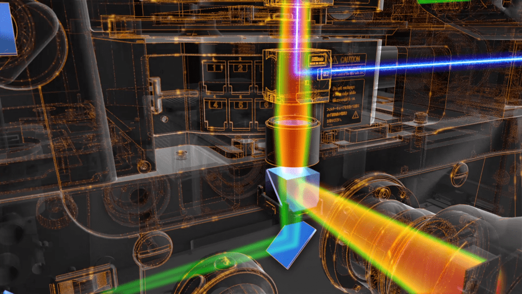 A digital, transparent rendering of intricate mechanical components in a machine, captured with the precision of a Nikon lens. Colorful beams of red, blue, green, and yellow light interact with metal parts, depicting an energy flow. Labels and caution signs are visible, resembling the detail on an Eclipse Ti2 microscope.