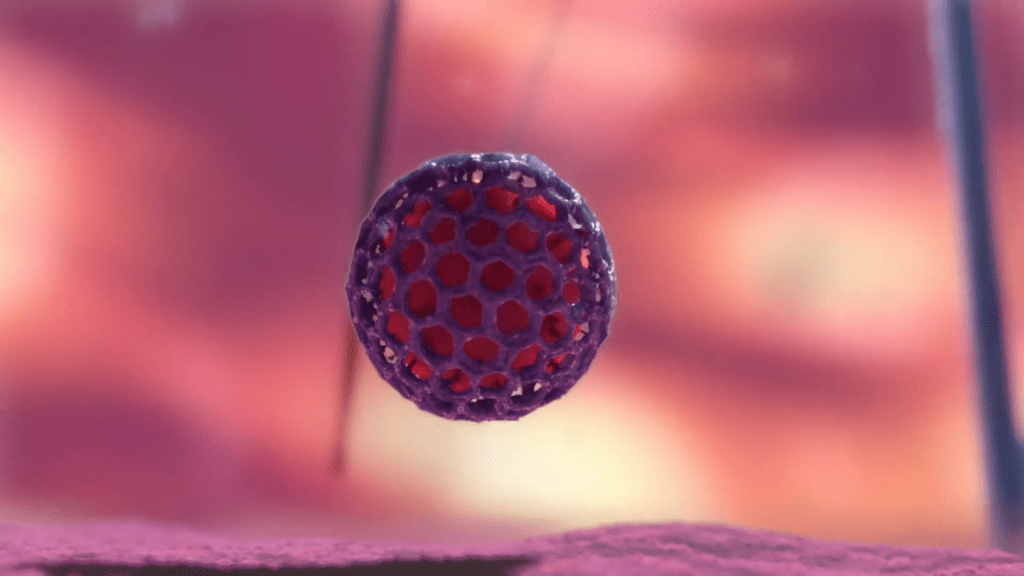 A close-up of a spherical object with a hexagonal pattern, resembling viruses, appears to be levitating. The backdrop is blurred with warm, pinkish hues, evoking a soft, abstract environment.
