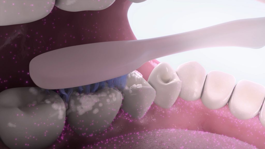 A close-up illustration of teeth being brushed with LISTERINE toothpaste shows a toothbrush cleaning the gums and teeth. Antiseptic purple specks and foam are visible, highlighting the oral care action in a stylized manner.